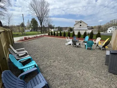 a group of lawn chairs and tables and chairs at 2 Bed Berkshire Getaway minutes to Jiminy Peak Ski in Hancock