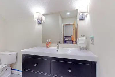 a bathroom with a sink and a toilet at Alpine Abode in Dover