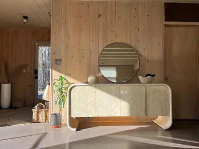 a bathroom with a mirror and a sink at Casa Del Rio in Margaretville
