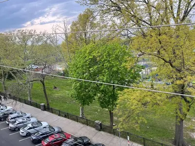 a bunch of cars parked in a parking lot at Cozy 3 BR suite, 15 min to NYC &Times Sq in North Bergen