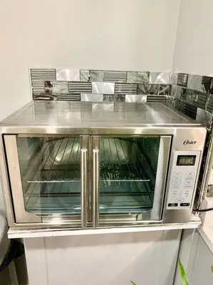 a microwave oven sitting on top of a counter at 3 Bedroom Duplex w Large Backyard in Brooklyn