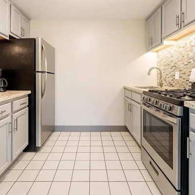 a kitchen with a stove and a refrigerator at Downtown Hartford Condo - Ciy Center - Prime Location in Hartford
