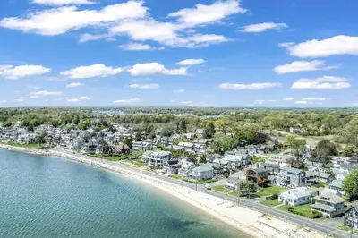 an aerial view of a beach with houses and condos at Beachside in Branford in Stamford