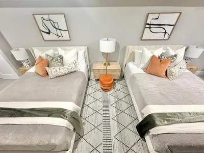two beds sitting next to each other in a room at Dream Home Close to the Center of NYC in Mott Haven
