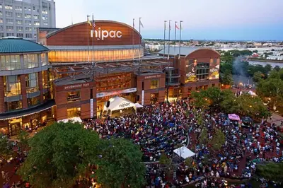 a large crowd of people in front of a building at Family & Traveler Haven - NYC & NWK w/free parking in Newark