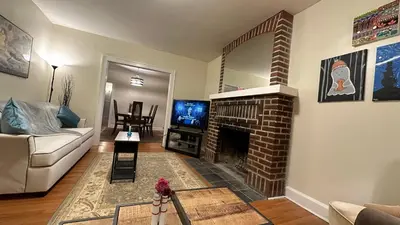 a living room with a couch and a fireplace at Cozy Albany Home in Albany
