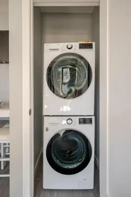 a washer and dryer in a room at Modern Apartment in Black Rock- in Bridgeport