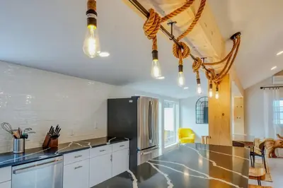 a kitchen with a counter top and a refrigerator at Brand New House with Large Porch in Lake Katrine in Lake Katrine