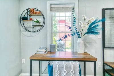 a table in a room with a vase of flowers at New 3b House in Saugerties Village 4 mins to HITs in Saugerties
