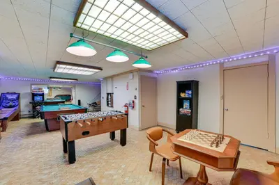 a room with two ping pong tables and a pool table at Massive Roscoe Retreat Great for Large Groups! in Roscoe