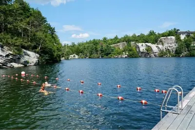 a group of people swimming in a body of water at Chateau Montreau on Hudson in Newburgh