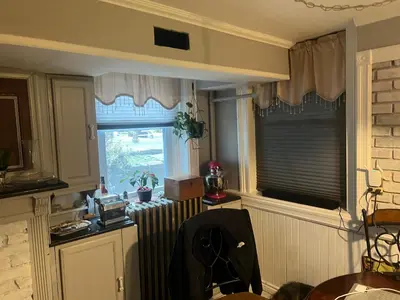 a kitchen with a radiator and a window at 2 Br Victorian Apt 2800 sq ft 2 floors with Full Kitchen 2 baths and Laundry in Poughkeepsie