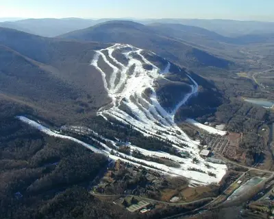 an aerial view of a snow covered mountain at Hunter Mountain Slope Side Home in Lanesville