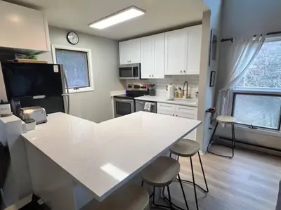 a kitchen with a white counter top in a room at Hunter Mountain Slope Side Home in Lanesville