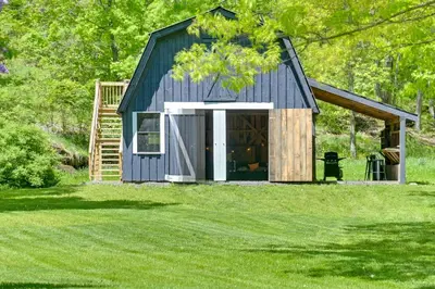 a blue house with a gambrel roof at Catskills Family Retreat Fishing and Hiking On-Site in East Durham