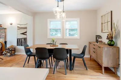 a dining room with a wooden table and chairs at Modern Rustic Escape w/Hot Tub - High Falls Lodge in Saugerties