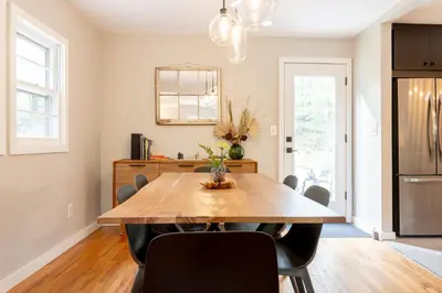 a dining room with a wooden table and chairs at Modern Rustic Escape w/Hot Tub - High Falls Lodge in Saugerties