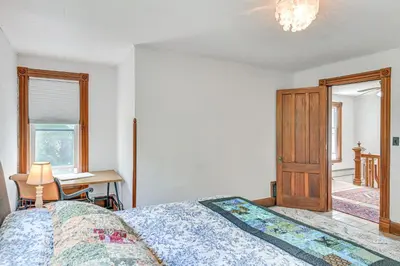 a bedroom with a bed and a desk and a window at Family Home with Yard and Fire Pit in Middleburgh! in Middleburgh