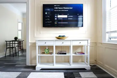 a living room with a tv on a wall at Newly Renovated - Minutes from the City in Woodside