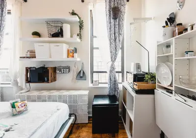 a small bedroom with a bed and a window at Cat Room by Delicate Stays LIVING ROOM CONVERSION SHARED SPACE ROOM ONLY CAT FRIENDLY ONLY 25 min to time square in Jackson Heights