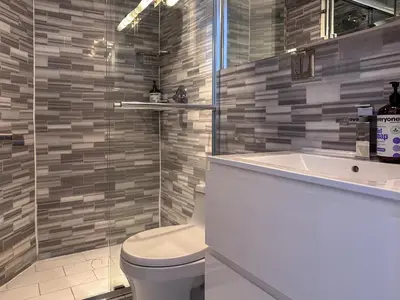 a bathroom with a toilet and a sink at New York Suite Upper East Side - Manhattan in New York