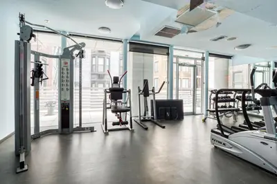 a gym with treadmills and elliptical machines at Midtown West 1br w gym wd nr bryant park NYC-1380 in New York