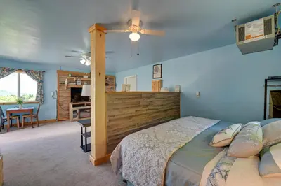 a bedroom with a bed and a ceiling fan at Cozy Catskills Studio Rental with Mountain Views! in Stamford