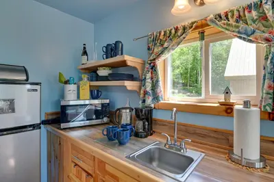 a kitchen with a sink and a refrigerator at Cozy Catskills Studio Rental with Mountain Views! in Stamford