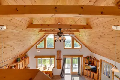 an overhead view of a log cabin with a vaulted ceiling at Catskills Cabin Rental with Hot Tub and Amazing Views! in Stamford