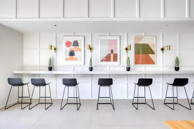 a waiting room with four chairs and framed art at Dumbo 2br w wd roof gym nr TimeOut Building NYC-961 in Brooklyn