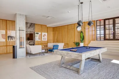 a living room with a pool table in it at Dumbo 2br w wd roof gym nr TimeOut Building NYC-961 in Brooklyn