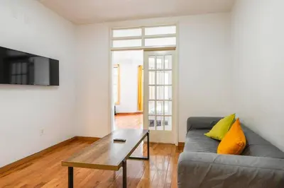 a living room with a couch and a coffee table at 9Away in The Bronx in Tremont