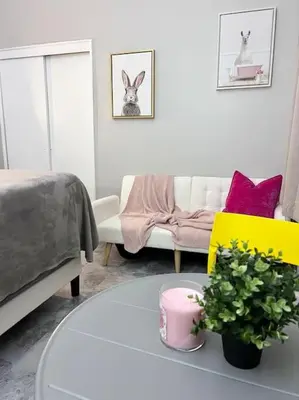 a living room with a table and a couch at Cozy apt in heart Manhattan #20 in New York