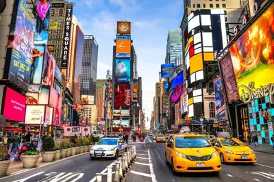 a busy city street with cars and buildings at Cozy apt in heart Manhattan #20 in New York