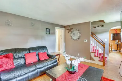 a living room with a leather couch and a table at Bring Your Pet and Visit Springfield Westfield Home in Westfield