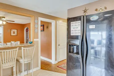 a kitchen with a stainless steel refrigerator in a room at Bring Your Pet and Visit Springfield Westfield Home in Westfield