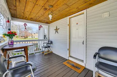 a porch with a table and chairs and a door at Bring Your Pet and Visit Springfield Westfield Home in Westfield