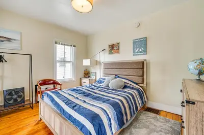 a bedroom with a bed with a stuffed animal on it at Bennington Gem with Smart TV Near Historic District! in Bennington