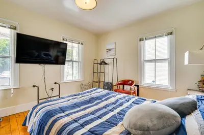 a bedroom with a bed and a flat screen tv at Bennington Gem with Smart TV Near Historic District! in Bennington