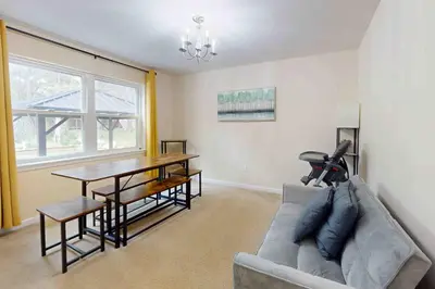 a living room with a couch and a table at Pocono Waterside Escape in Tobyhanna