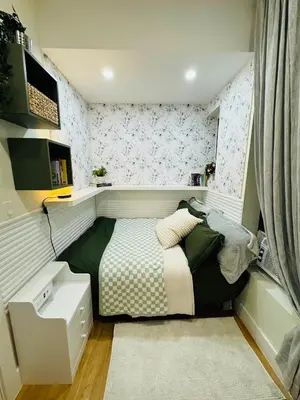 a small bedroom with a bed in a room at Columbus House in New York
