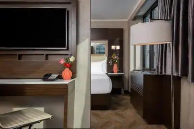 a hotel room with a bed and a flat screen tv at Holiday Inn Brooklyn Downtown by IHG in Brooklyn