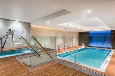 a large swimming pool in a building with a pool at Holiday Inn Brooklyn Downtown by IHG in Brooklyn