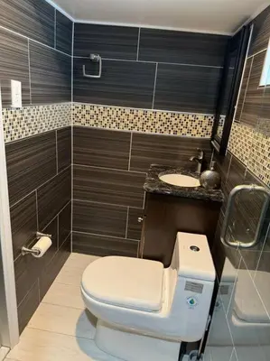 a bathroom with a toilet and a sink at La Casa Bonita Near NYC in Yonkers