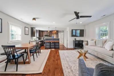 a living room with a table and a couch at Azure Loft by Saratoga Stays in Saratoga Springs