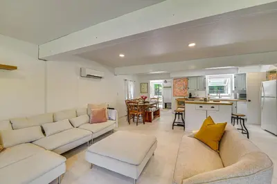 a living room with two couches and a kitchen at Charming Catskills Getaway Hike, Bike, Sip and More in Acra