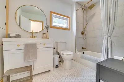 a bathroom with a sink and a toilet and a mirror at Charming Catskills Getaway Hike, Bike, Sip and More in Acra