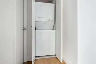 a kitchen with a refrigerator and a microwave at Chelsea 1br w roofdeck gym nr Flatiron NYC-1384 in New York