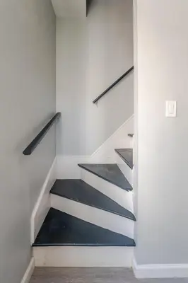 a staircase in a house with black and white at Modern 3 Bed House in Black Rock in Bridgeport