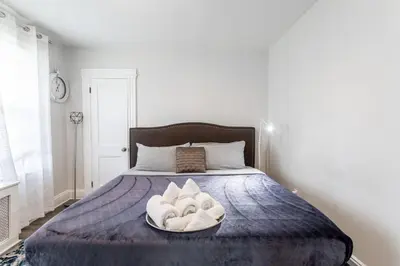 a bed with a bowl of towels on it at Spacious&Gracious- 5BR Fam-Friendly near I95&Shops in Fairfield